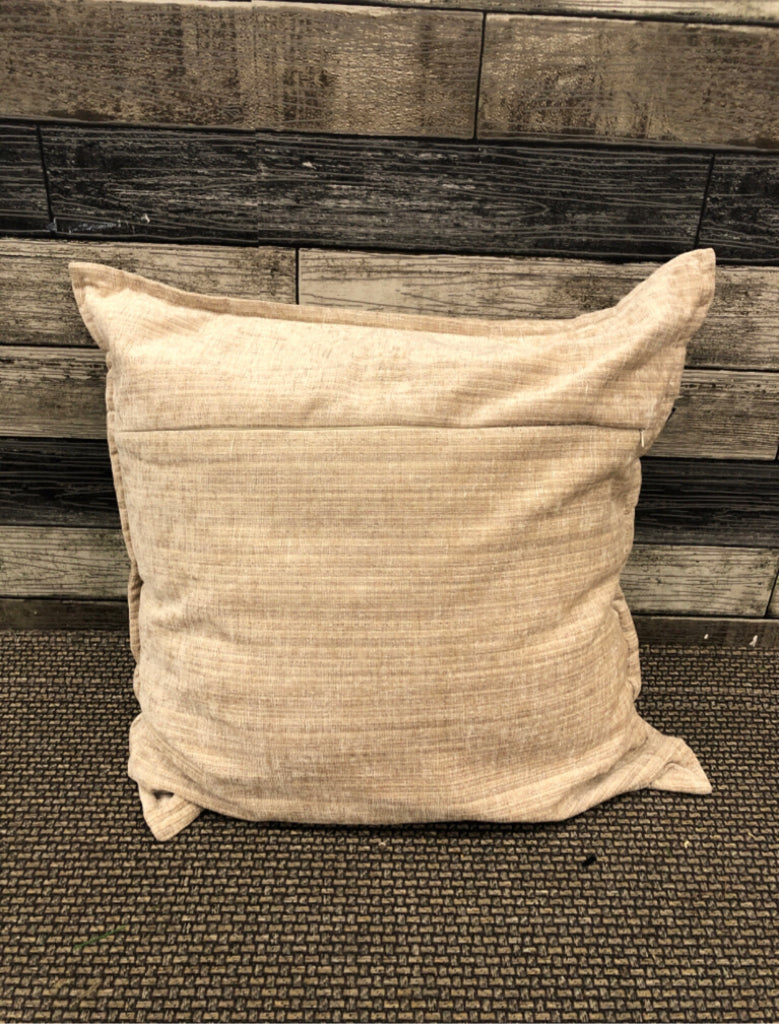 TAN AND CREAM PILLOW.