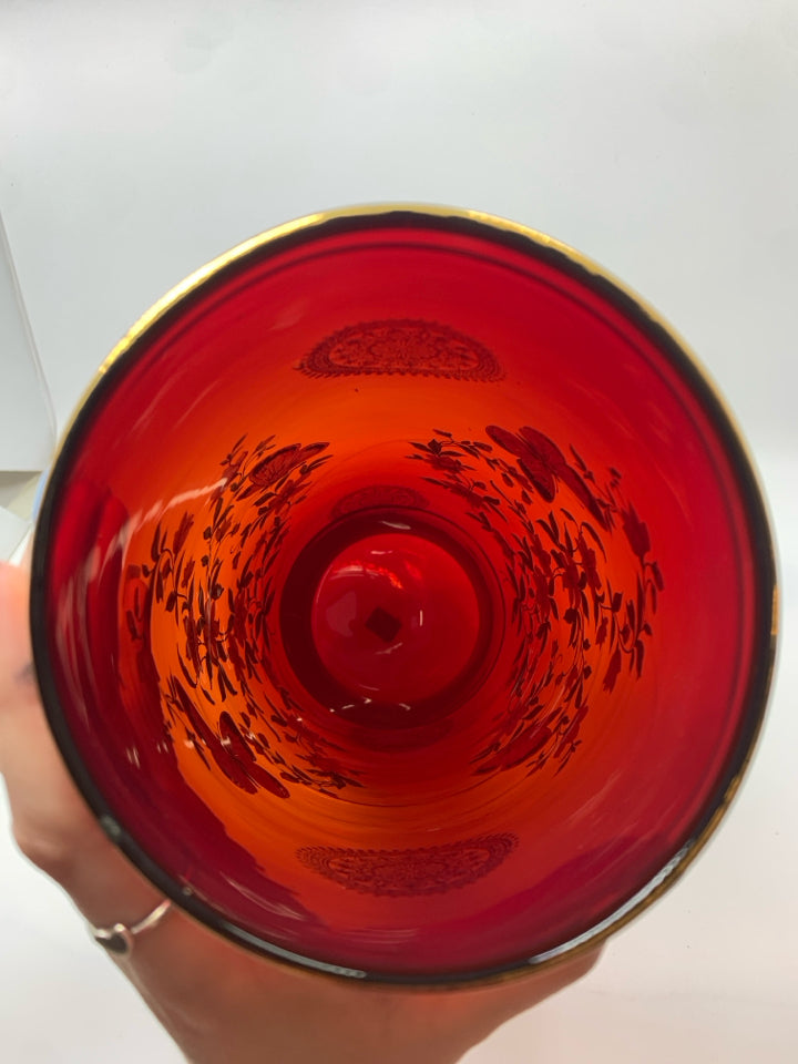 VTG RED GLASS VASE W/PAINTED FLOWERS AND GOLD RIM.