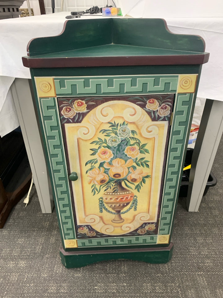 SMALL CORNER CABINET DARK GREEN/MAROON W/ VASE YELLOW ROSES.