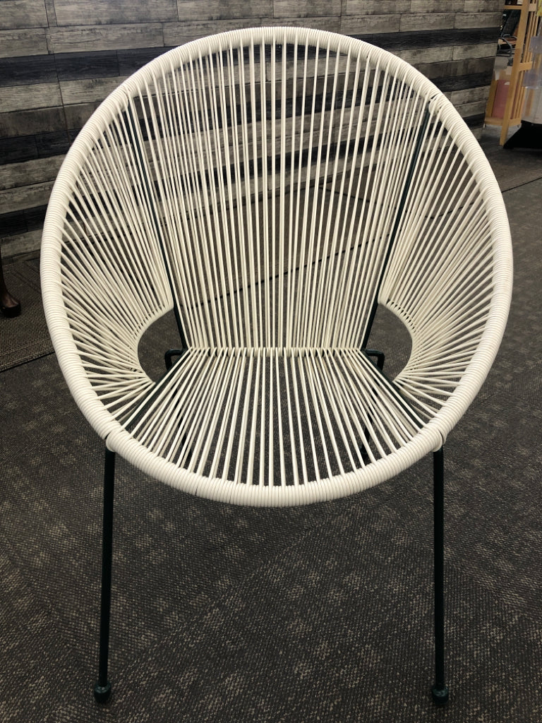 WOVEN PLASTIC EGG-SHAPED CHAIR W/GREEN LEGS.