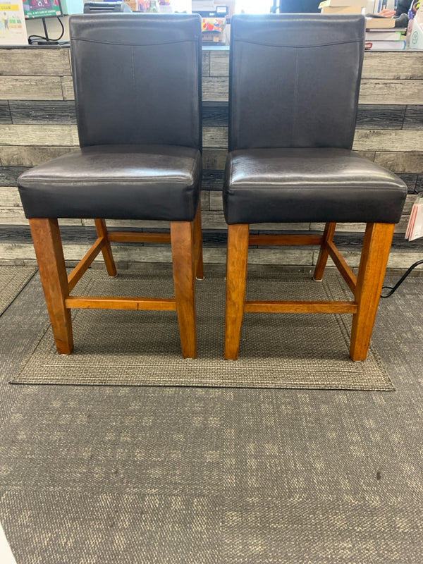 2 FAUX BROWN LEATHER COUNTER STOOLS.