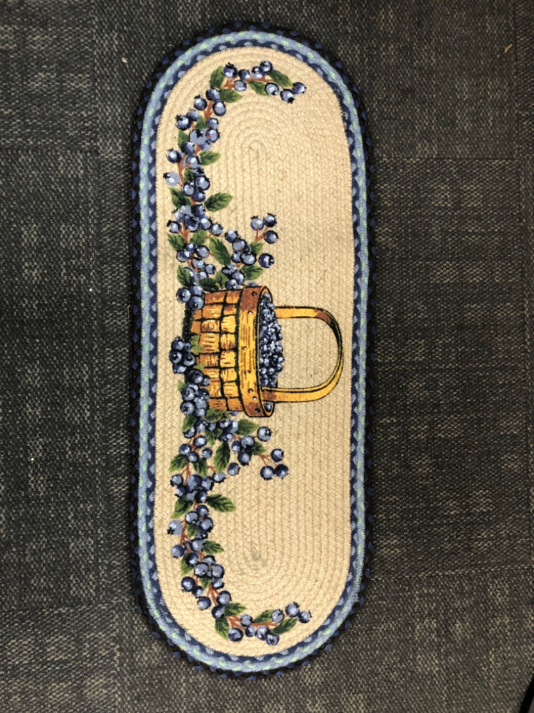 OVAL NARROW BRAIDED RUG W/ PAINTED BLUEBERRIES.