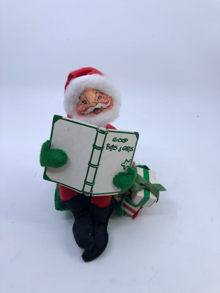 ANNA LEE SANTA HOLDING NAUGHTY NICE BOOK.