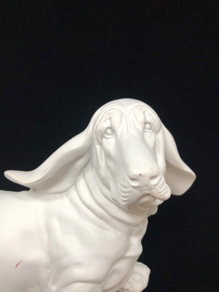 WHITE CERAMIC DOG FIGURINE.