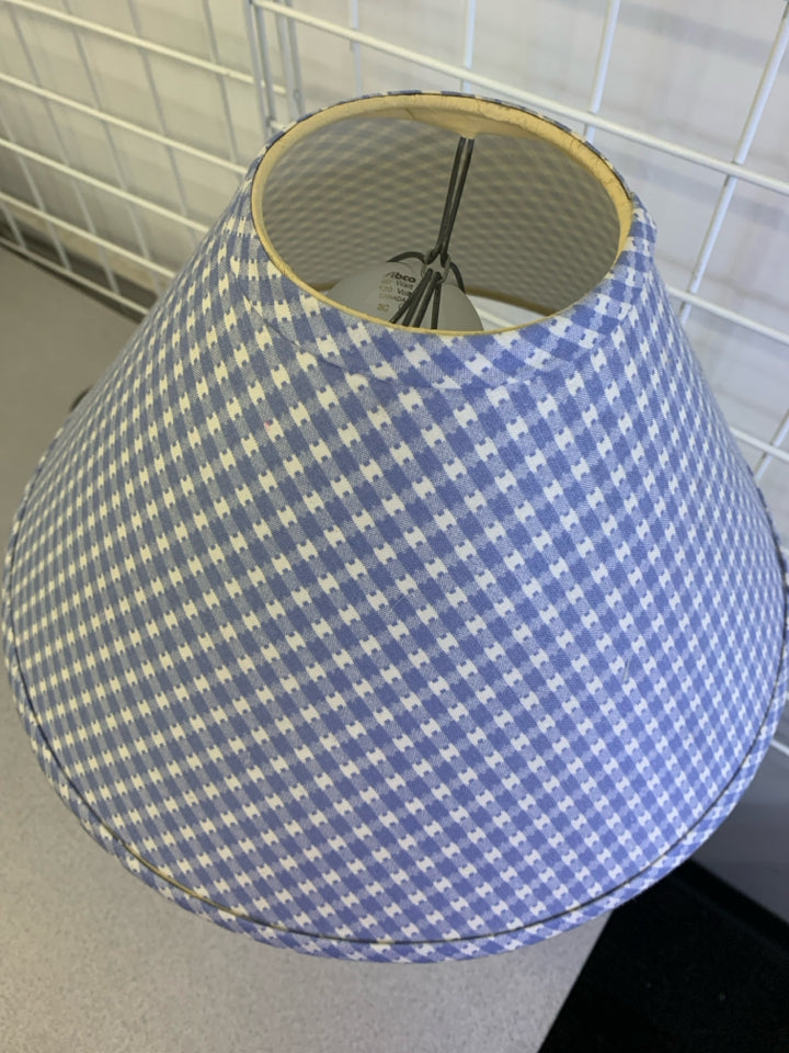 WHITE ABSTRACT BASE LAMP W BLUE AND WHITE CHECKERED SHADE.