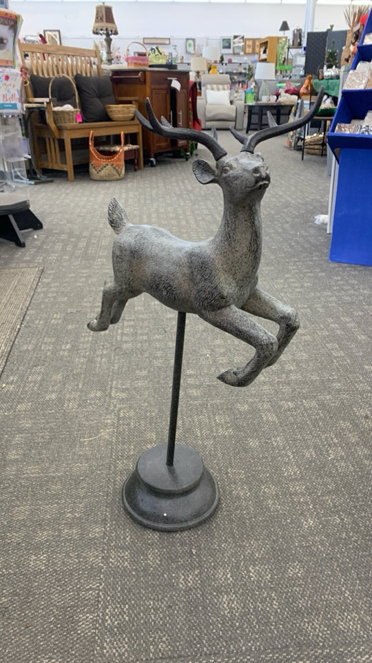 METAL REINDEER SCULPTURE ON HEAVY BASE.