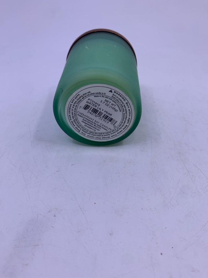 NEW BALANCE & HARMONY SCENTED CANDLE IN GREEN JAR.