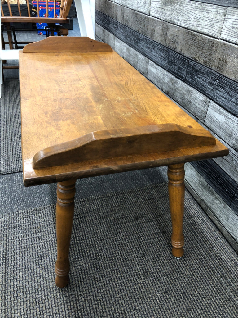 VTG SHORT WOODEN COFFEE TABLE W/RAISED SIDES.
