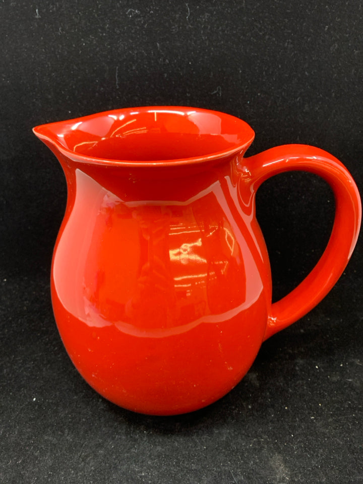 RED CERAMIC PITCHER.