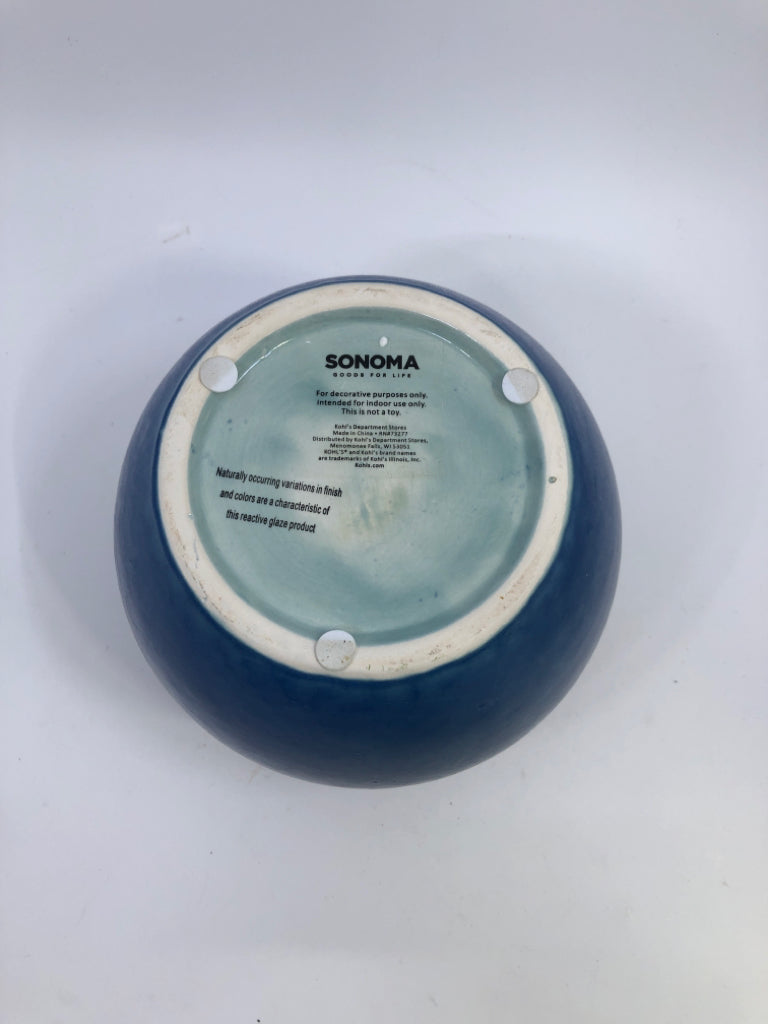 BLUE CERAMIC VASE W/ LIGHT COLORED NECK FAUX LEAVES.