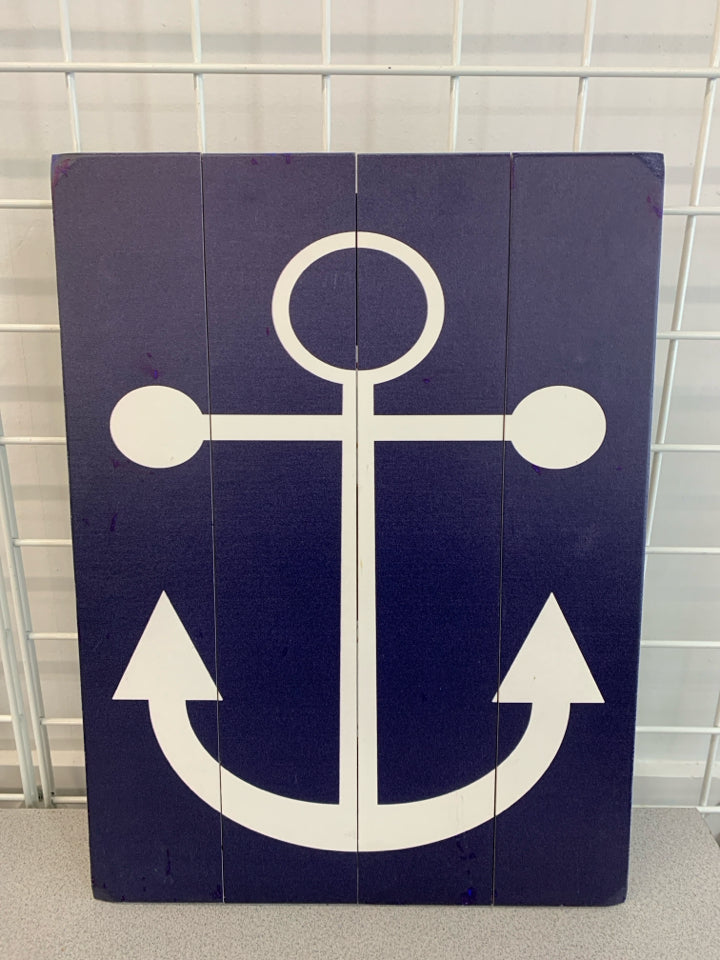 WHITE ANCHOR PAINTED ON WOOD WALL HANGING.