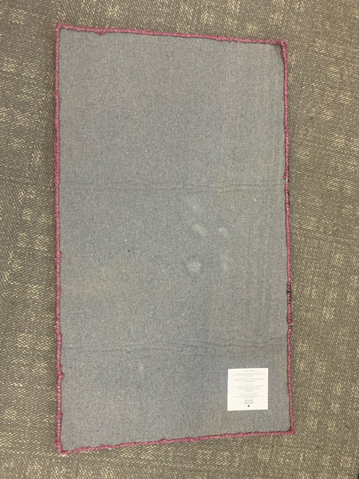 PURPLE WITCH BOOTS HAND HOOKED ACCENT RUG.