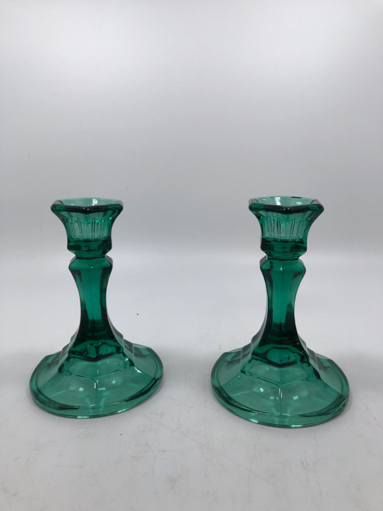2 GREEN GLASS CANDLE STICK HOLDERS.