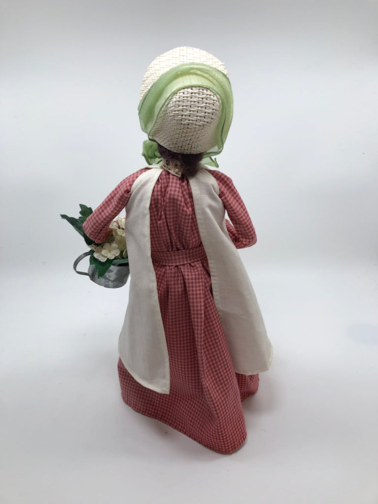 BYERS CHOICE CAROLER W/WATERING CAN.