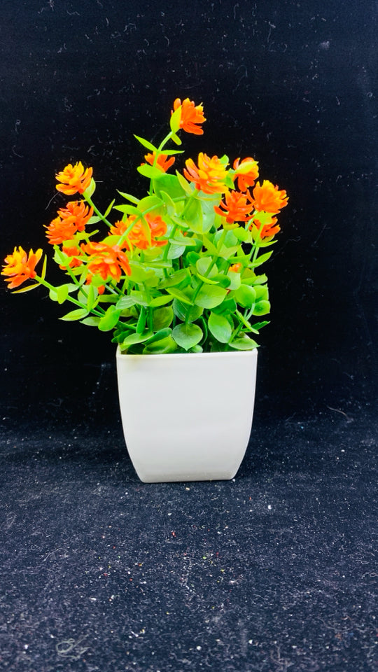 6 FAUX FLOWERS IN WHITE POTS.