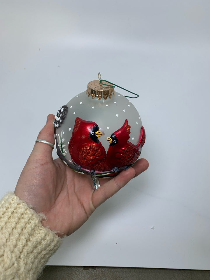 FROSTED GLASS BULB W/ EMBOSSED CARDINALS ORNAMENT.
