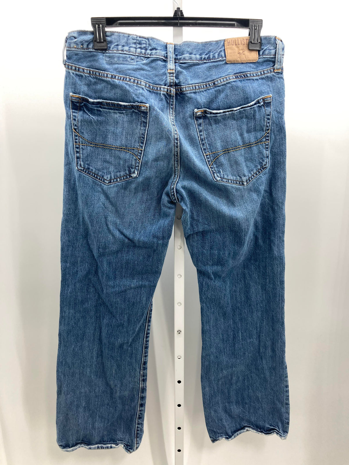 DISTRESSED BUTTON FLY JEANS