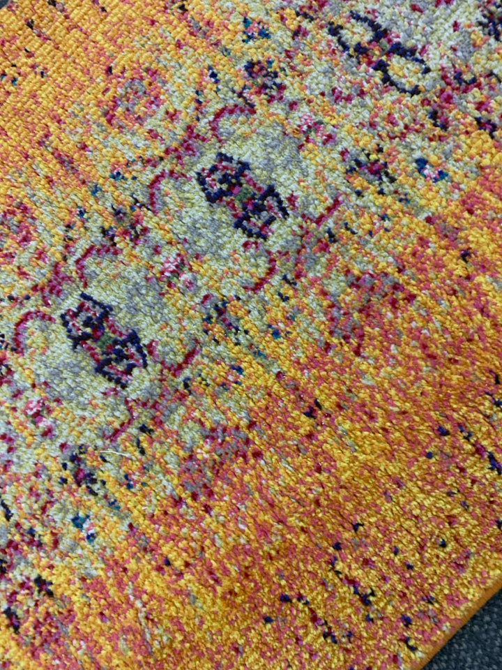 ORANGE MULTI COLORED RUG RUNNER.