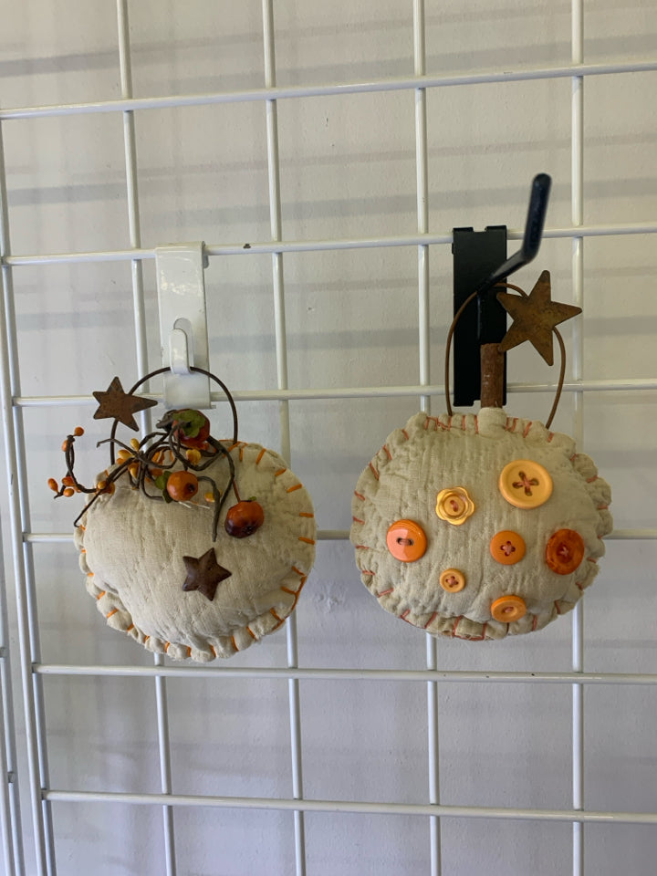 2 PRIMITIVE WALL HANGING PUMPKINS.