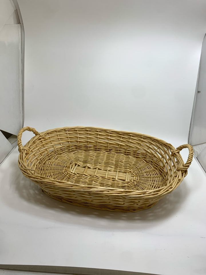 OVAL WICKER BASKET W/HANDLES.