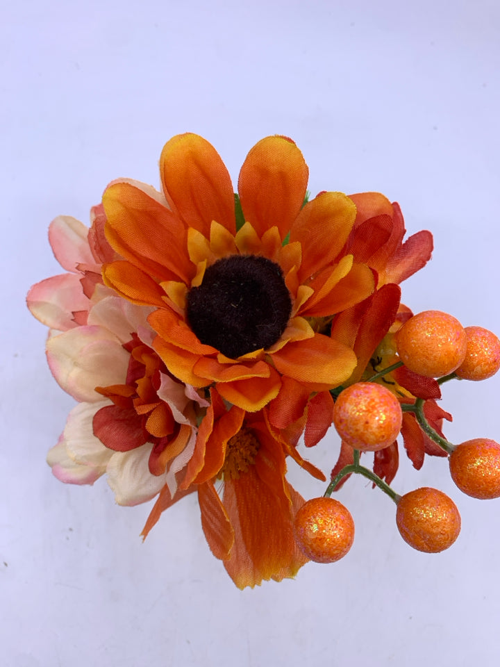 SMALL ORANGE FLORAL ARRANGEMENT.