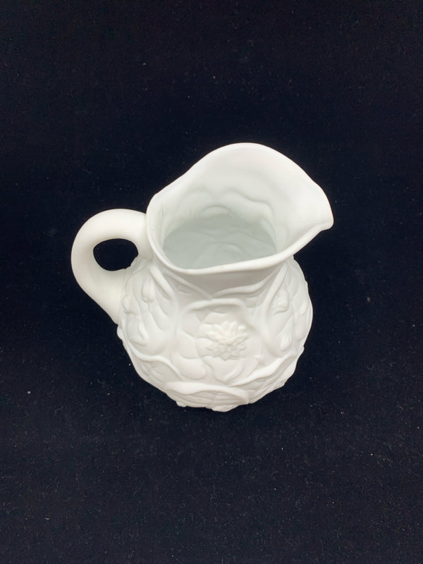 WHITE EMBOSSED FLORAL PITCHER.