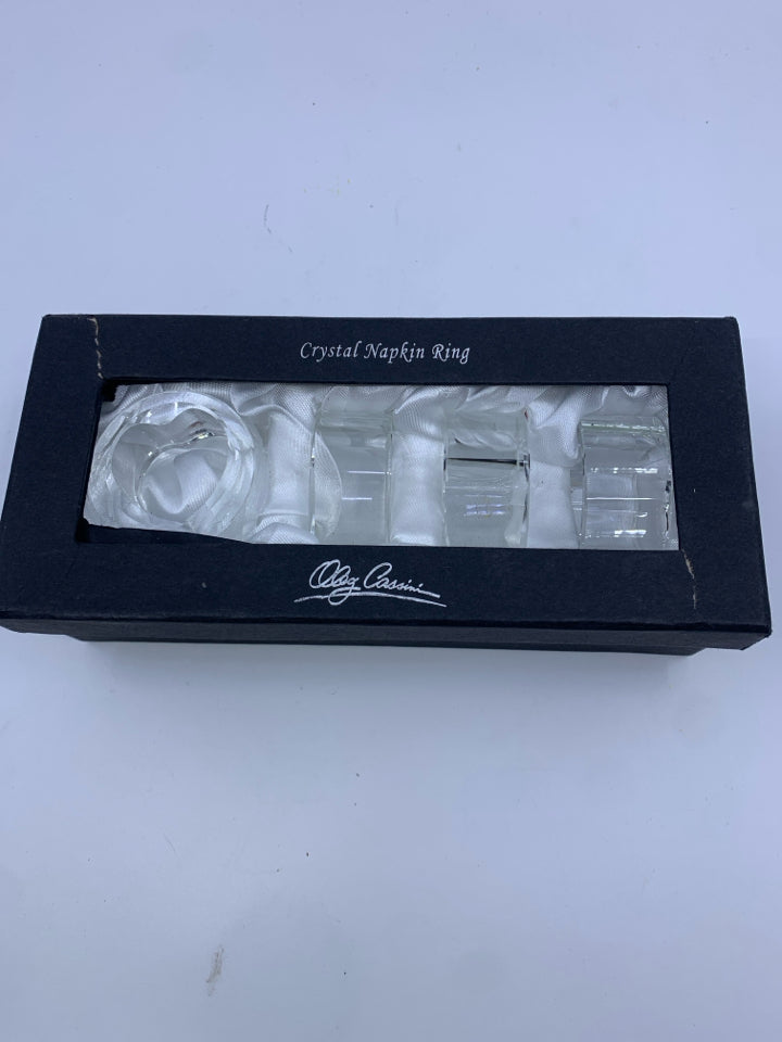 4 NIB CRYSTAL NAPKIN RINGS.