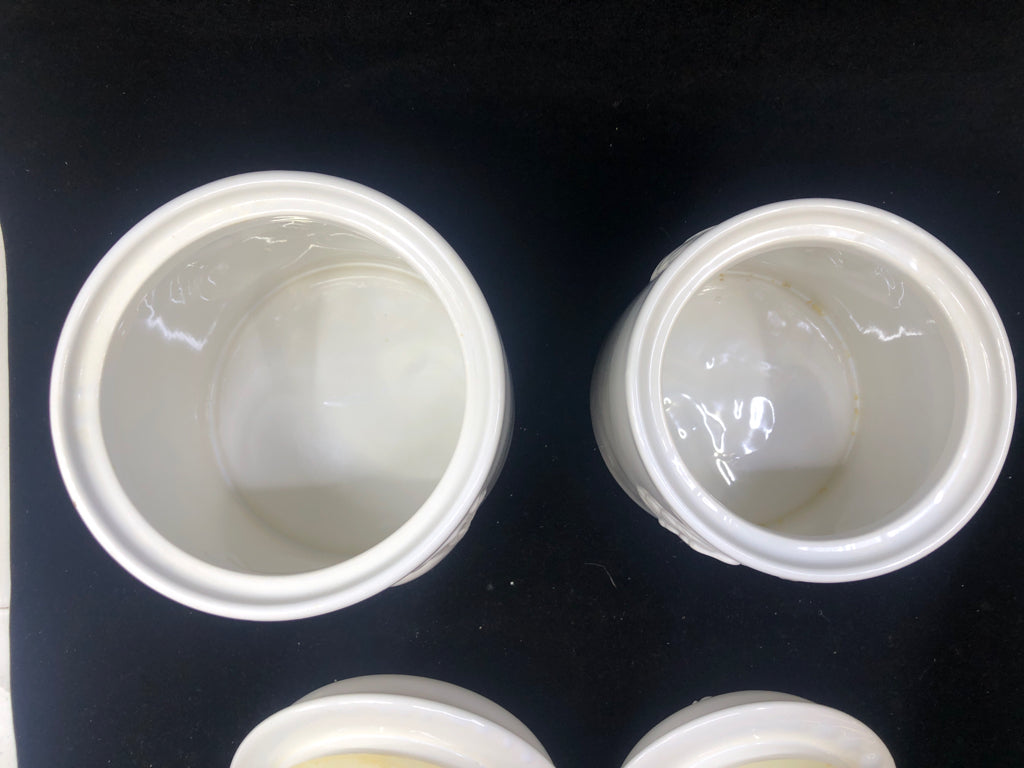 2 WHITE EMBOSSED APPLE CANISTERS.