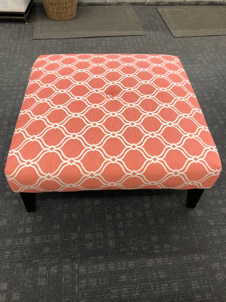 CORAL OTTOMAN W/WHITE DIAMOND DESIGN.