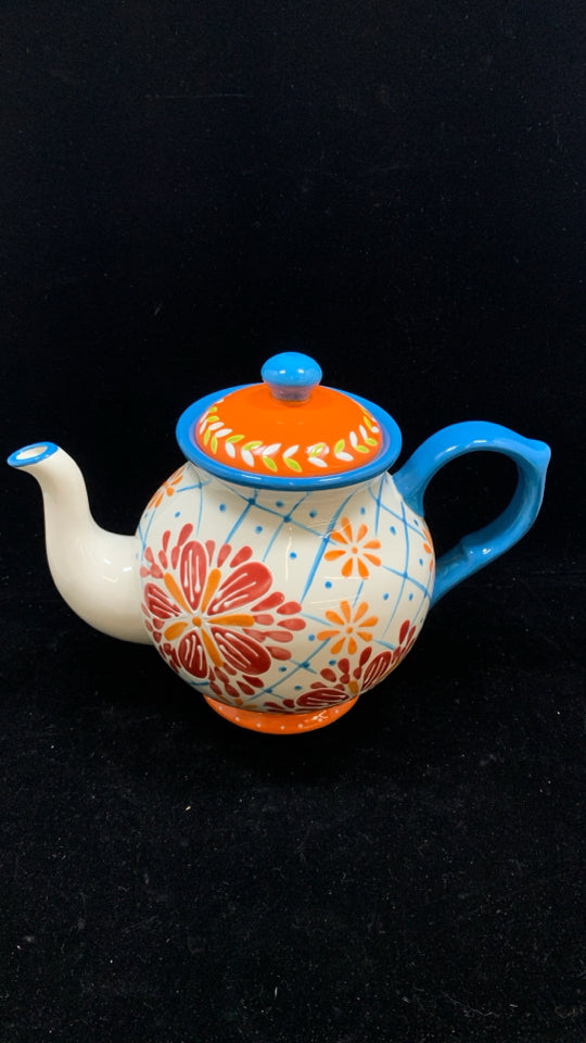 COLORFUL FLORAL TEAPOT W/BLUE HANDLE.