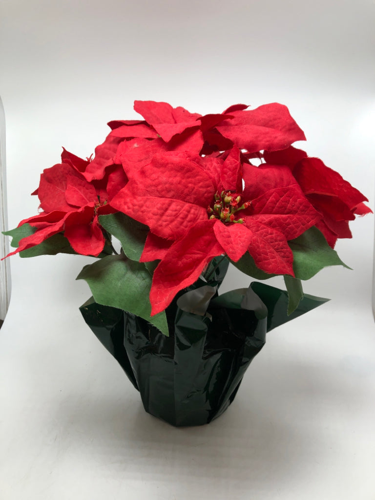 FAUX POINSETTIA IN GREEN WRAP POT.