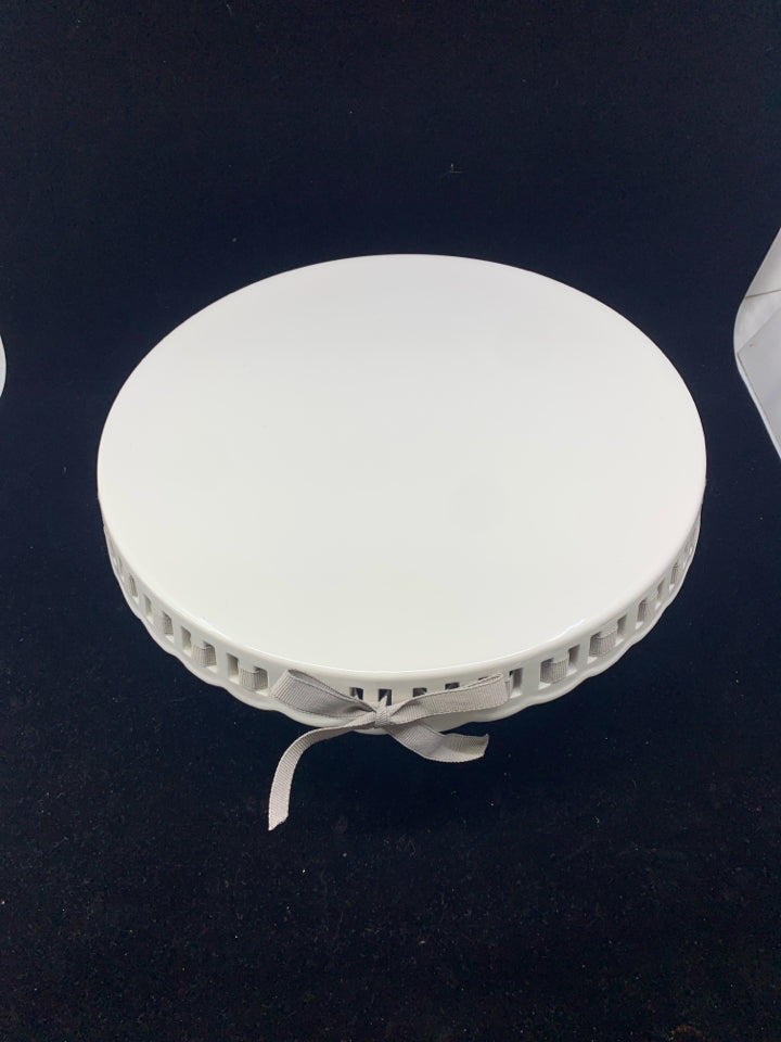 WHITE CAKE STAND W/ GRAY BOW DETAIL.