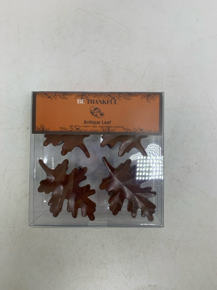 NIP 4 METAL ANTIQUE LEAF NAPKIN RINGS.