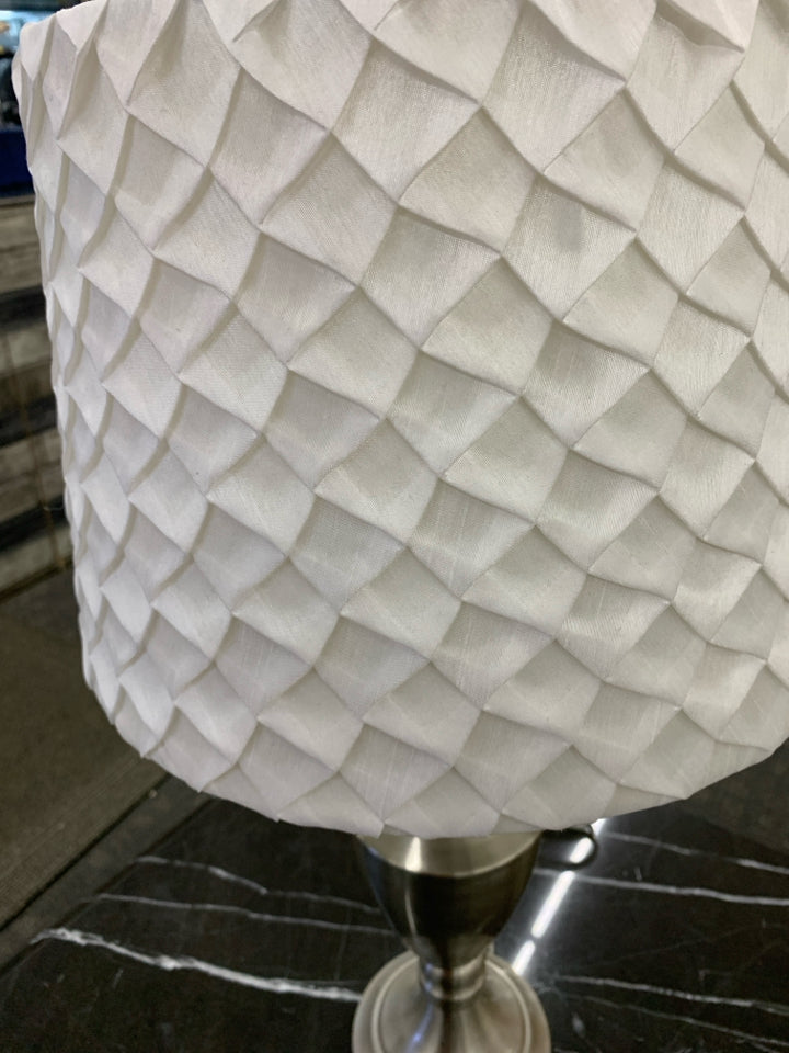 SILVER BASE LAMP W WHITE RUFFLED SHADE.