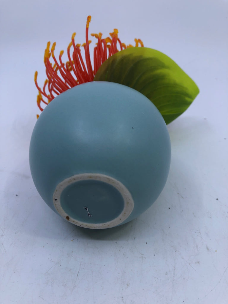 SMALL TEAL VASE W/ FAUX LEAVE ORANGE FLOWER.