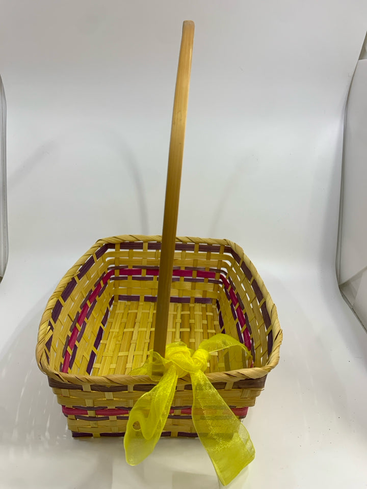 YELLOW & PURPLE WICKER BASKET W/HANDLE & RIBBON.