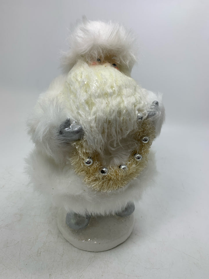 HEAVY SHORT IN ALL WHITE SANTA HOLDING WREATH ROBERT STANLEY.