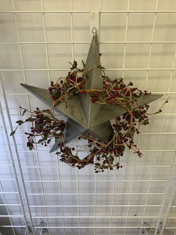 METAL STAR WALL HANGING W/ BERRY WREATH.
