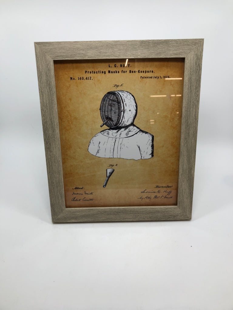 BEE KEEPING PROTECTING MASK FRAMED PRINT.