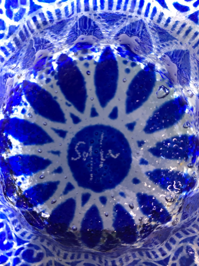 GLASS BOWL W/ COBALT BLUE/CLEAR RUFFLED EDGE.