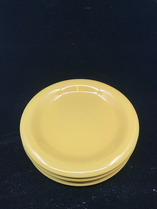 4 MUSTARD YELLOW LUNCH PLATES.