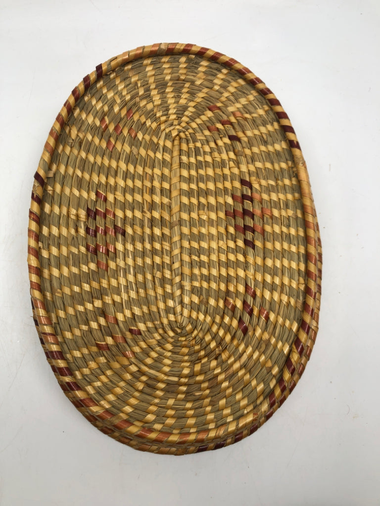 SHALLOW WOVEN BASKET W/RED ACCENTS.