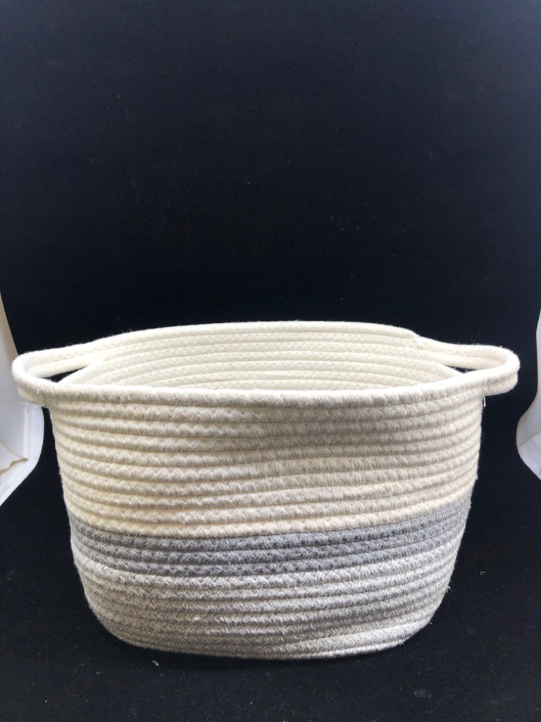 GREY AND WHITE WOVEN BASKET W HANDLES.
