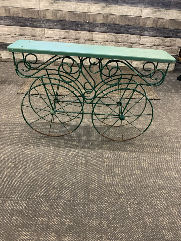 DISTRESSED RUSTIC PLANT STAND W/METAL WHEELS.