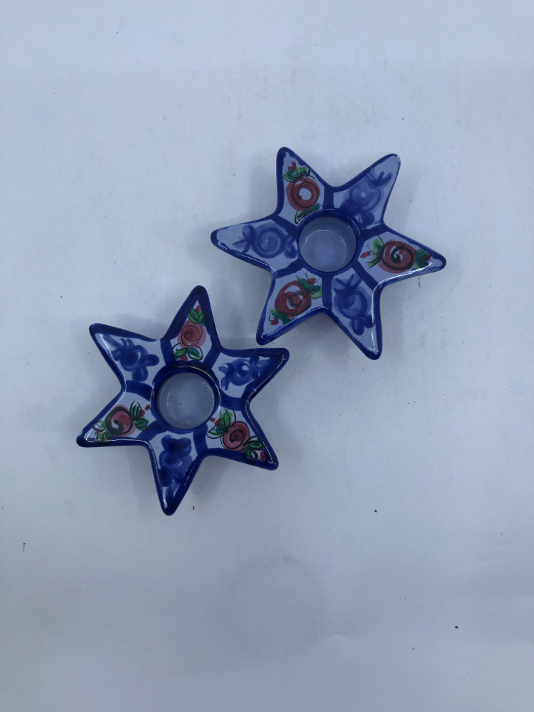 2 BLUE STAR CANDLE HOLDERS.