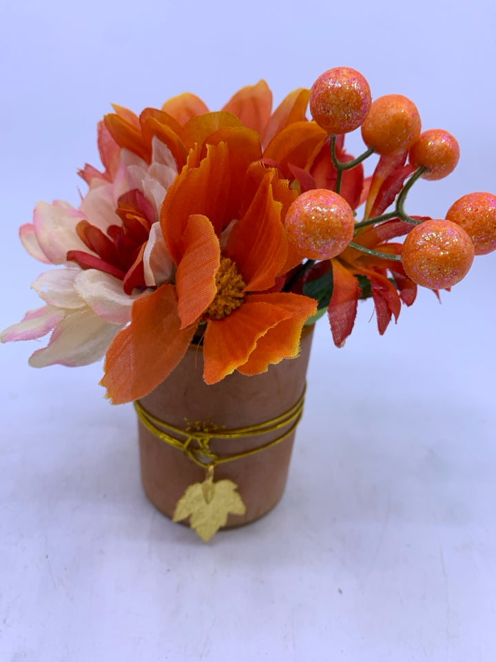 SMALL ORANGE FLORAL ARRANGEMENT.
