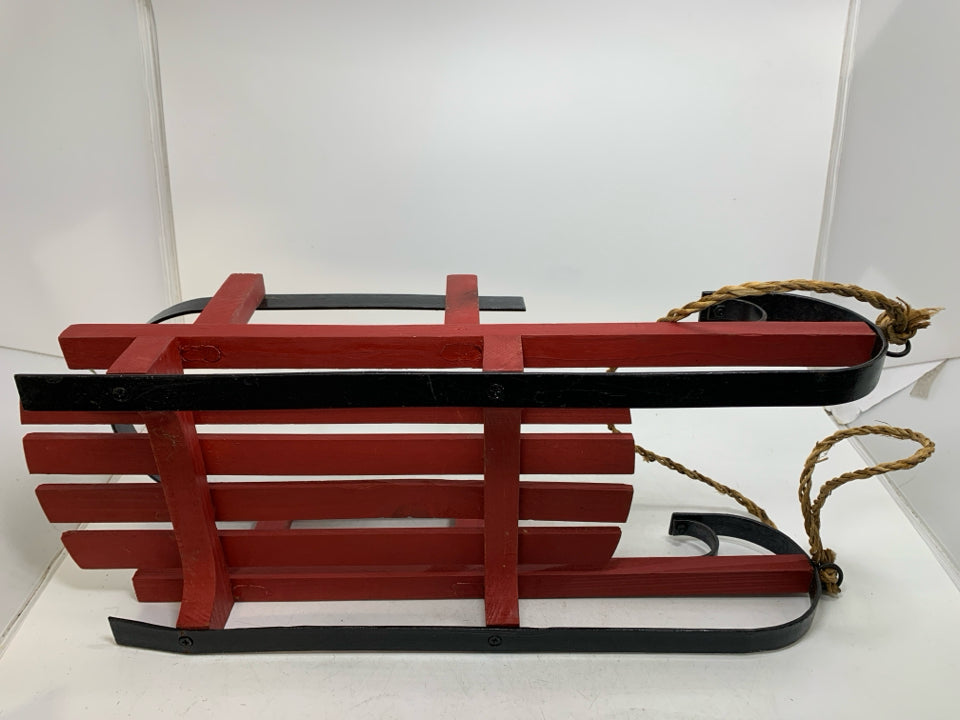 HEAVY WOOD RED SLED W/ METAL FEET.