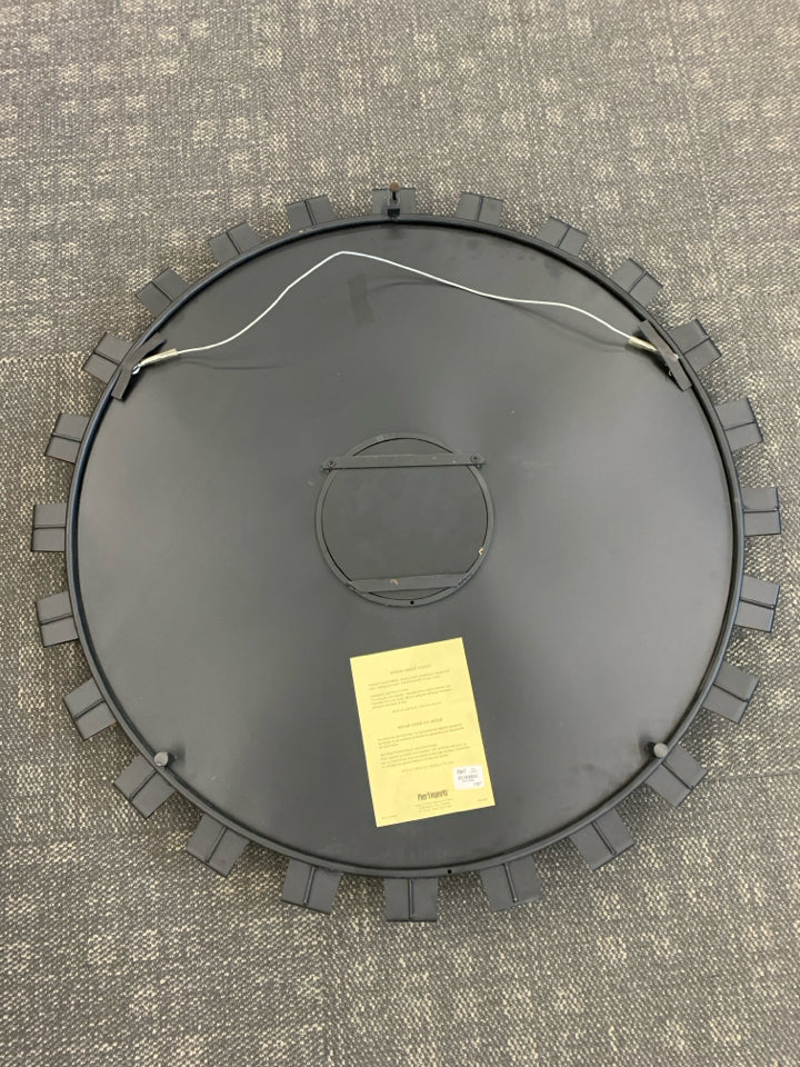 RED TINTED ROUND METAL MIRROR.