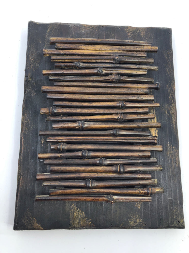 DARK WOOD BAMBOO STICKS WALL HANGING.