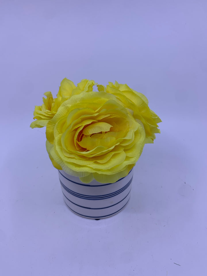 YELLOW FLORAL IN BLUE AND WHITE VASE.